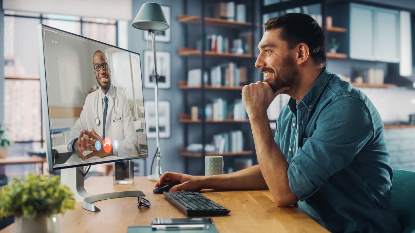 A patient at home on a video visit with a licensed provider